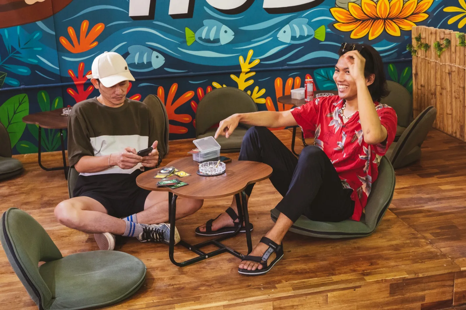 Backpackers hanging out together in the on-site cannabis lounge at The Hub Laidback Hostel, Ao Nang