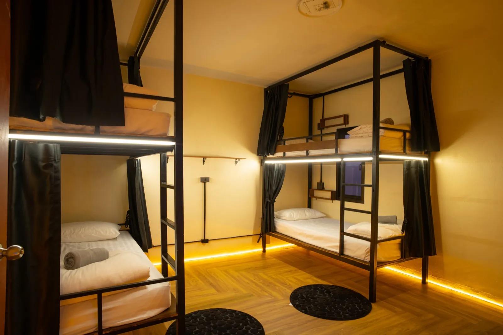 Air-conditioned dorm beds with privacy curtains at The Hub Laidback Hostel, Ao Nang